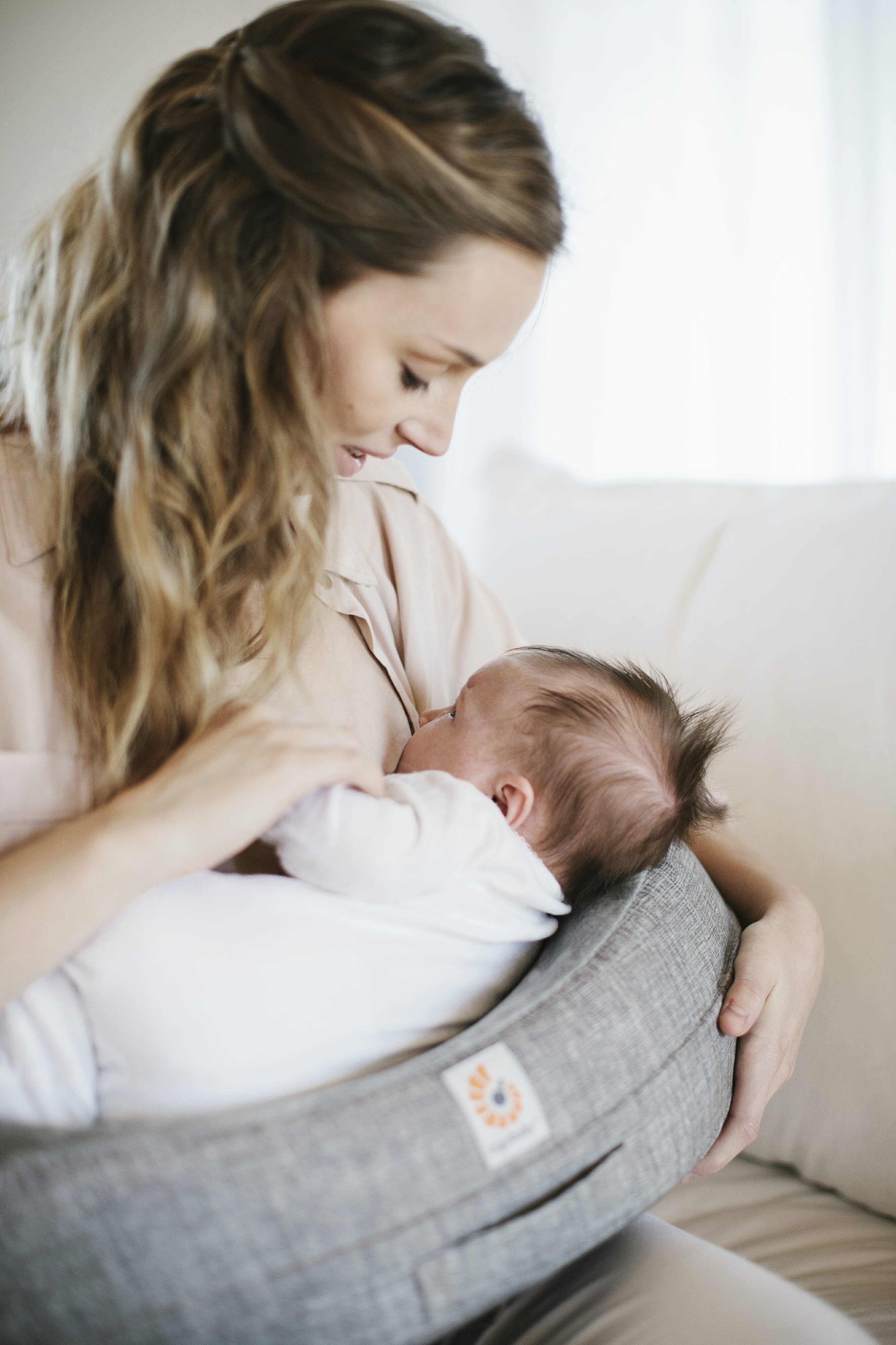 Let a feeding pillow take the strain, babies do get heavy!