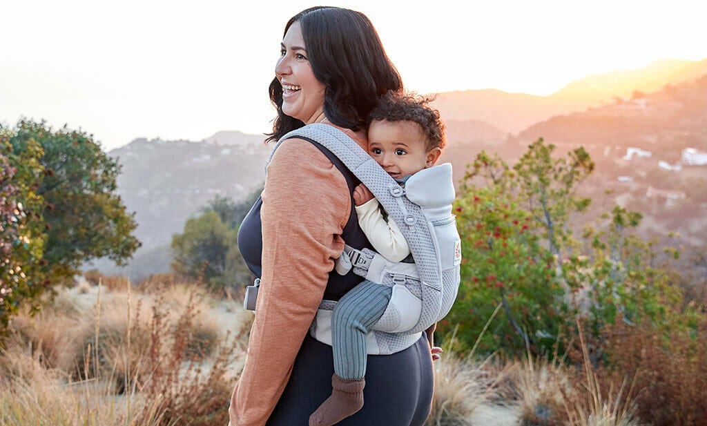 Mum out for a walk with baby in a baby carrier