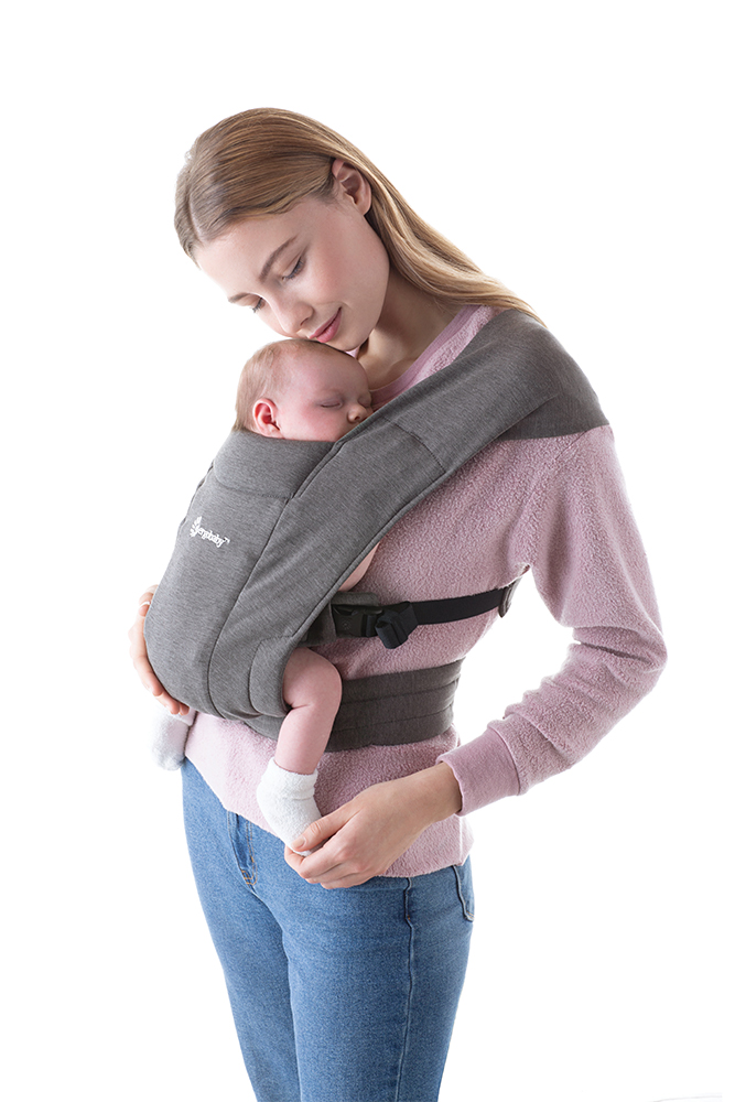 Mom using Embrace Newborn Front Carry